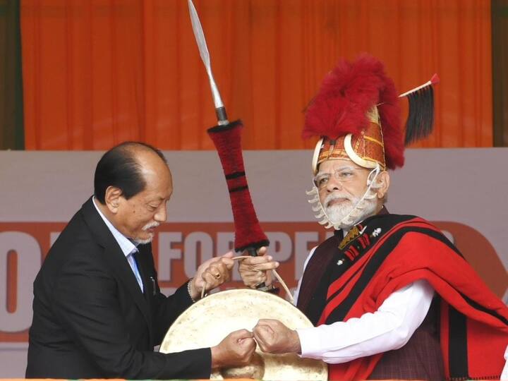 Nagaland CM Neiphiu Rio felicitates PM Narendra Modi ahead of his public address, on Friday, February 24, in Dimapur. (Source: ANI)