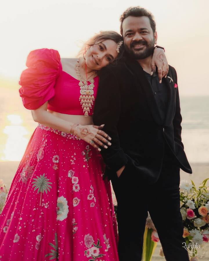 She accessorised her ensemble with modest gold-tone jewellery, fresh makeup, and loose waves. Varun appeared sharp in a black suit.