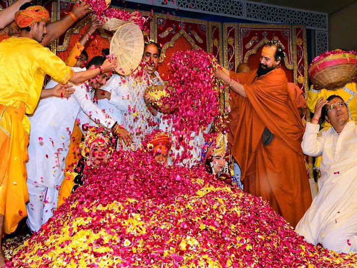 Holi heralds the end of winter and the beginning of spring. According to folklore, King Hiranyakashipu desired that his subjects solely adore him. But his own son, Prahlad, continued to revere Lord Vishnu. Hiranyakashipu, enraged, resolved to punish his son. He urged his fire-resistant sister Holika to join Prahlad in the fire. When she did, her cloak flew away and covered Prahlad, rescuing him, but killing Holika. (Image Source: PTI)