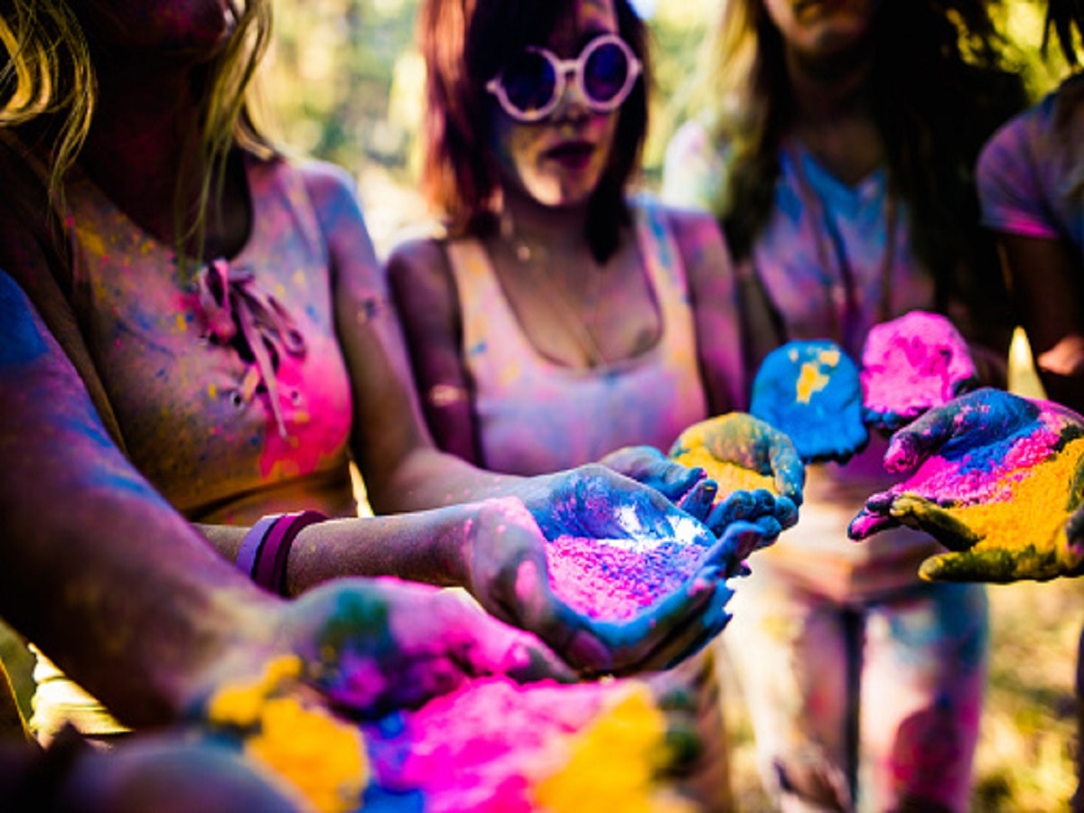 Premium Photo | Young woman in messy holi powders wearing trendy sunglasses