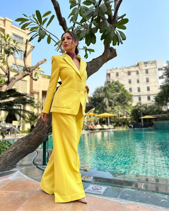 Pictures of Malaika wearing a bright yellow blazer and pants outfit were posted by renowned stylist Tanya Ghavri.