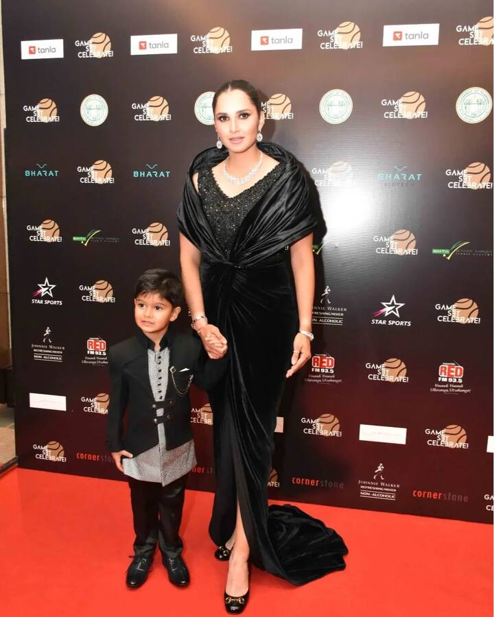 Sania looked gorgeous in a black velvet dress as she struck a pose with her son. She accessorised her look with dainty diamond jewellery and styled her hair in a sleek bun.