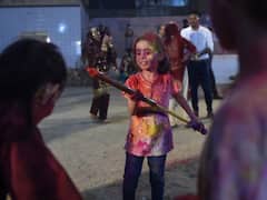Holi In Pakistan: Hindu Community Celebrates Festival Of Colours In Karachi's Sri Swaminarayan Temple