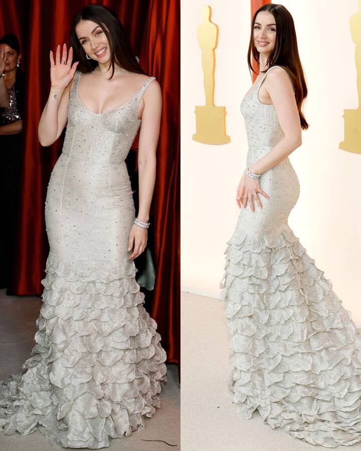 Ana de Armas donned a silver dress with a statement skirt at the 95th Annual Academy Awards. The ruffled detailing of her skirt gave her a dramatic look. She kept her look subtle going in for open tresses styled straight and minimal make-up.