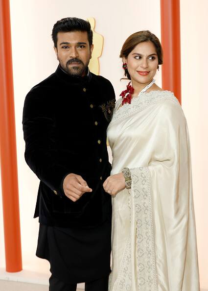 Ram Charan celebrated homegrown artisans withcustom-made Shantanu and Nikhil creation for the Oscars. The ensemble was inspired from his RRR Character with medallion buttons & brooches that look like chakras. (Image: Getty Images)