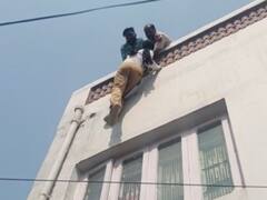 Punjab: लुधियाना में पुलिस की गिरफ्त से फिल्मी अंदाज में फरार हुआ आरोपी, फिर बिल्डिंग पर लटका..., देखें तस्वीरें