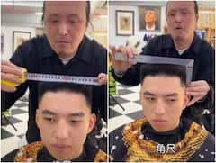 नाई है या सिविल इंजीनियर... नाप जोख बैठाकर हैरतअंगेज अंदाज में काट रहा बाल