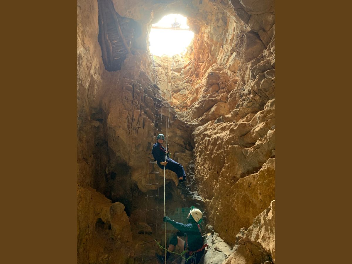 This photo shows the 17-metre drop that is the entrance to Mairs Cave in the southern Flinders Ranges.  In December 2021, the team behind the latest research traveled to the cave.  They found a partial skeleton, including leg and wing bones, and a skull.  From these, they were able to describe the new species.  (Photo credit: Aaron Camens)