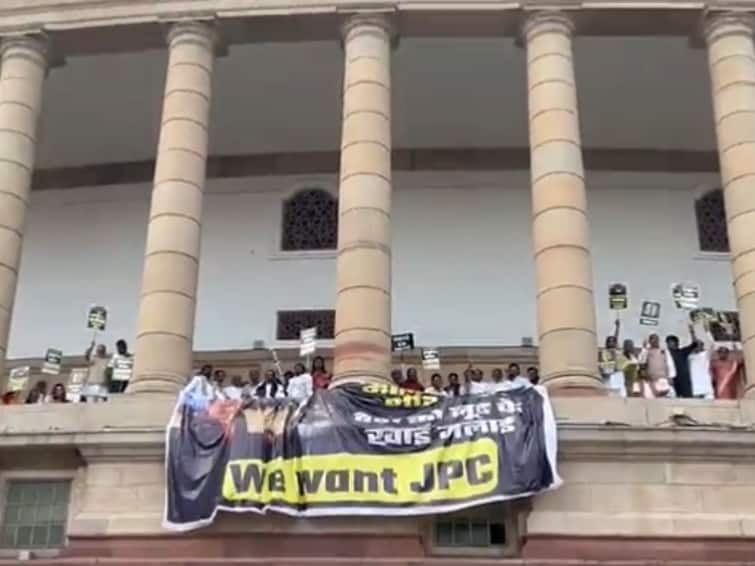 We Want JPC Oppn Hangs Banner With Adani Photo From Parliament Balcony watch 'We Want JPC': Oppn Hangs Banner With Adani Photo From Parliament Balcony — Watch