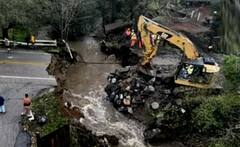 PHOTOS: अमेरिका में चक्रवाती तूफान का कहर, कई शहर हुए जलमग्न, सड़कें धंसीं, बिजली गुल, देखें कैसे हुई बर्बादी