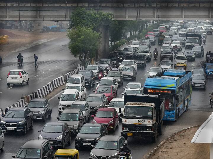 Vehicles stuck in a traffic jam on Outer Ringer Road amid rainfall, near Pragati Maidan in New Delhi, Friday, March 24, 2023.