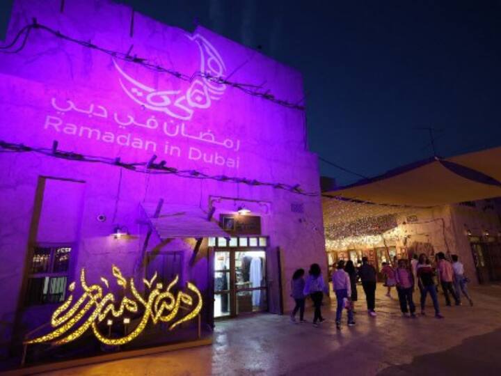 People walk past decorations during the Muslim holy fasting month of Ramadan, at Al-Seef in Dubai.