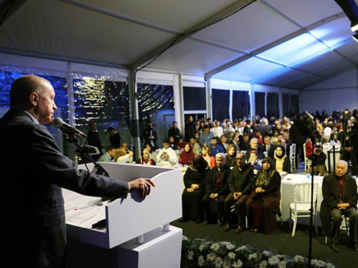 Turkish President Recep Tayyip Erdogan (L) speaks at an iftar (fast-breaking) dinner with quake affected people in Istanbul. The powerful 7.8 magnitude earthquake that jolted Turkey and Syria killed 45,000 people.