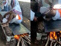 'कभी-कभी मेरे शरीर में दैवीय शक्ति...' जलते चूल्हे पर बैठे भक्तों को गाली देते बाबा का वीडियो वायरल