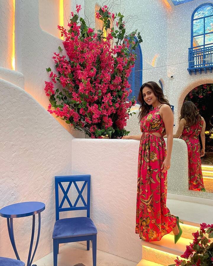 Blooming in her long maxi pink floral dress, Nushrratt is defiantly giving us major outfit goals here.