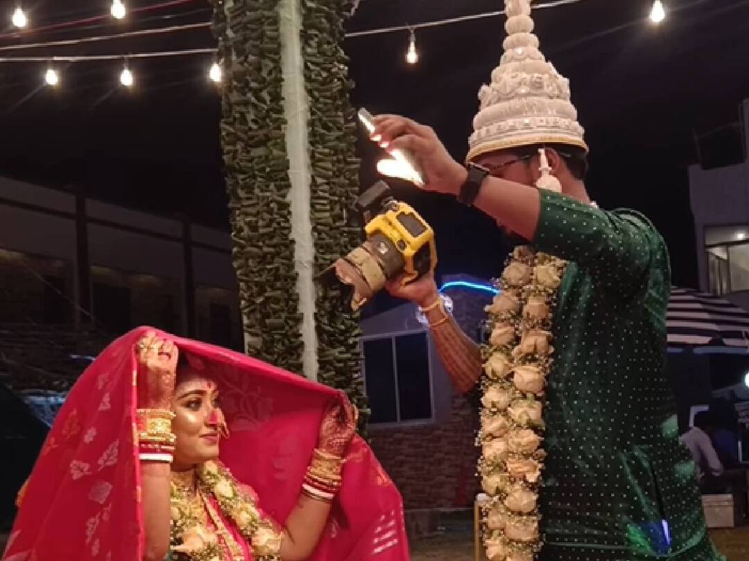 மணமேடையில் மனைவியை புகைப்படம் எடுத்த புகைப்பட கலைஞர்..  என்ன புதுமை? வைரலாகும் வீடியோ..