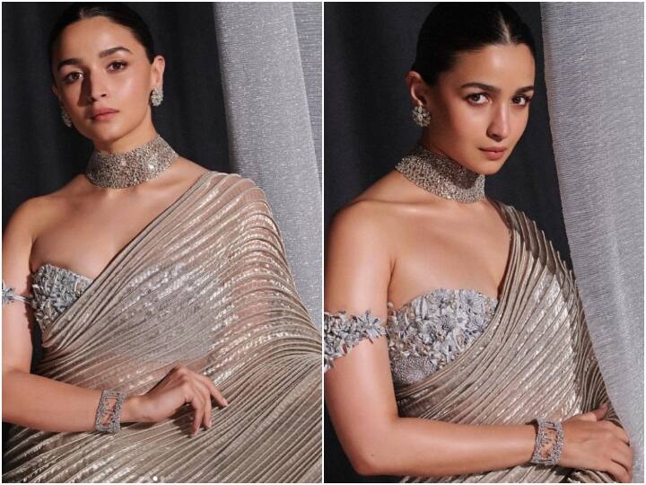 Alia Bhatt Saree Pics: शुक्रवार शाम 'नीता मुकेश अंबानी कल्चरल सेंटर' के लॉन्च इवेंट पर आलिया भट्ट ने शिमरी सिल्वर साड़ी पहनी थी. एक्ट्रेस इस साड़ी लुक में बलां की खूबसूरत लग रही थीं.