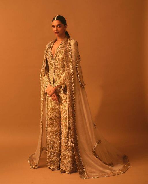 Deepika Padukone wore an all-embroidered beige outfit which she accessorised with a rather unusual mang tikka and still managed to look elegant