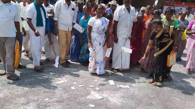 Dharmapuri People threw their Aadhaar cards at the collector's office demanding the return of the temple land TNN தருமபுரியில் கோயில் நிலத்தை மீட்டு தர கோரி ஆதார் அட்டையை ஆட்சியர் அலுவலகத்தில் வீசி சென்ற மக்கள்