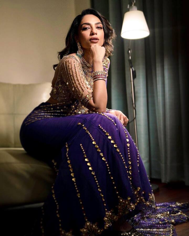 She paired the outfit with heavy gold jewellery with red and green polkis. (Image Source: Instagram/Sobhita Dhulipala)