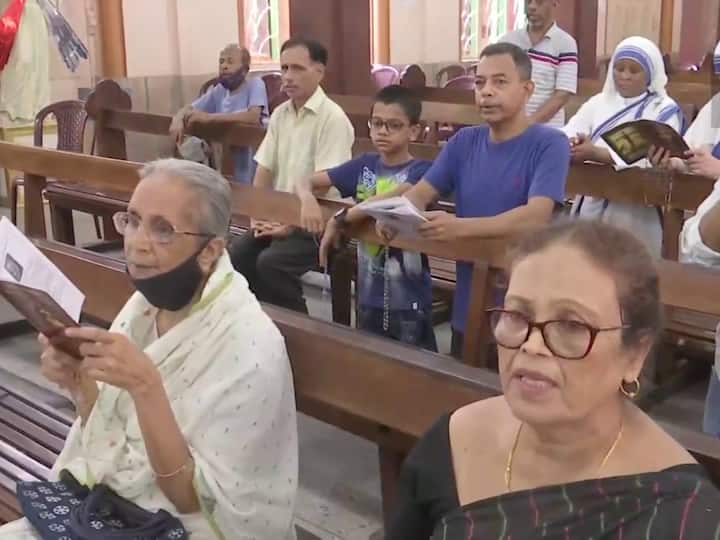 Parishoners sing choirs during Good Friday mass at St. Teresa's Church.