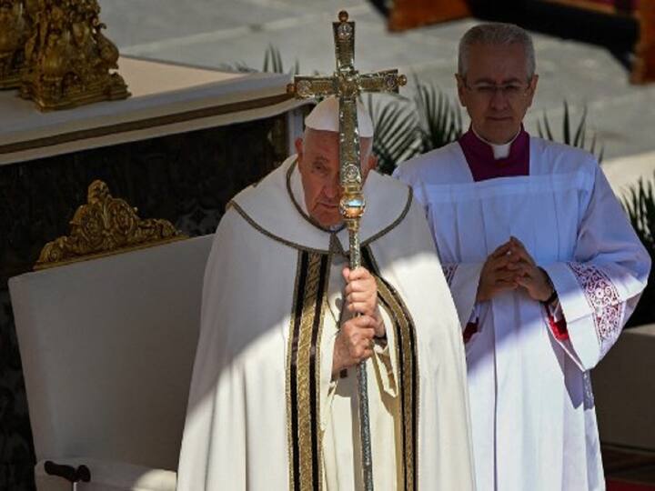 Pope Francis preside over an Easter vigil ceremony at the Vatican's St. Peter's Basilica. After a procession up the centre aisle by candle-carrying cardinals and other churchmen, the service in St Peter's Basilica began in darkness and was dramatically bathed in light. (Image Source: AFP)