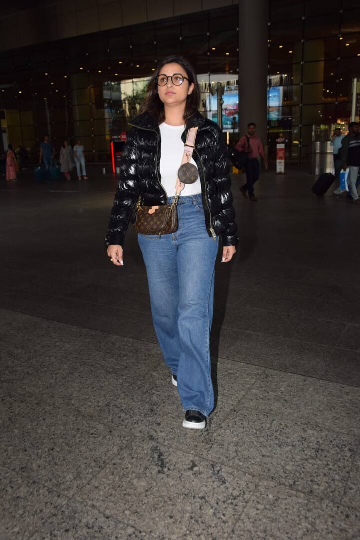Parineeti wore blue denims, white T and a black puffer jacket