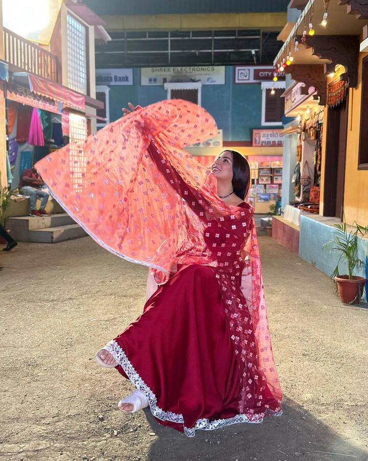 Shraddha struck many a poses while seated on a chair in her red ethnic dress