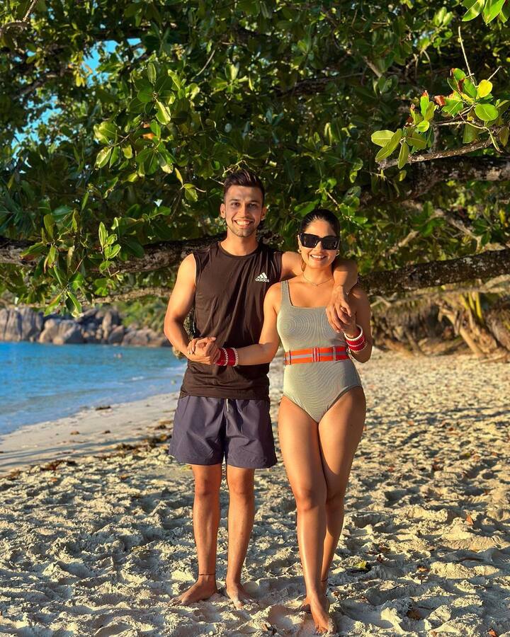 The actor posed with her husband in the series of pictures on the beach.