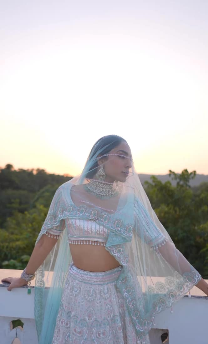 Sobhita radiated beauty in a white blouse with multicoloured thread patterns.