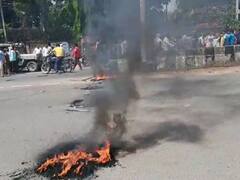 धनबाद में जमीन कारोबारी की हत्या के विरोध में ग्रामीणों का हंगामा, हाईवे जामकर की नारेबाजी