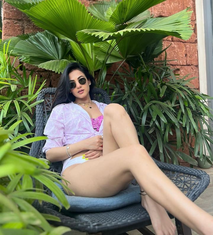 In one of the pictures, she can be seen oozing oomph by throwing over a white shirt over her bikini.
