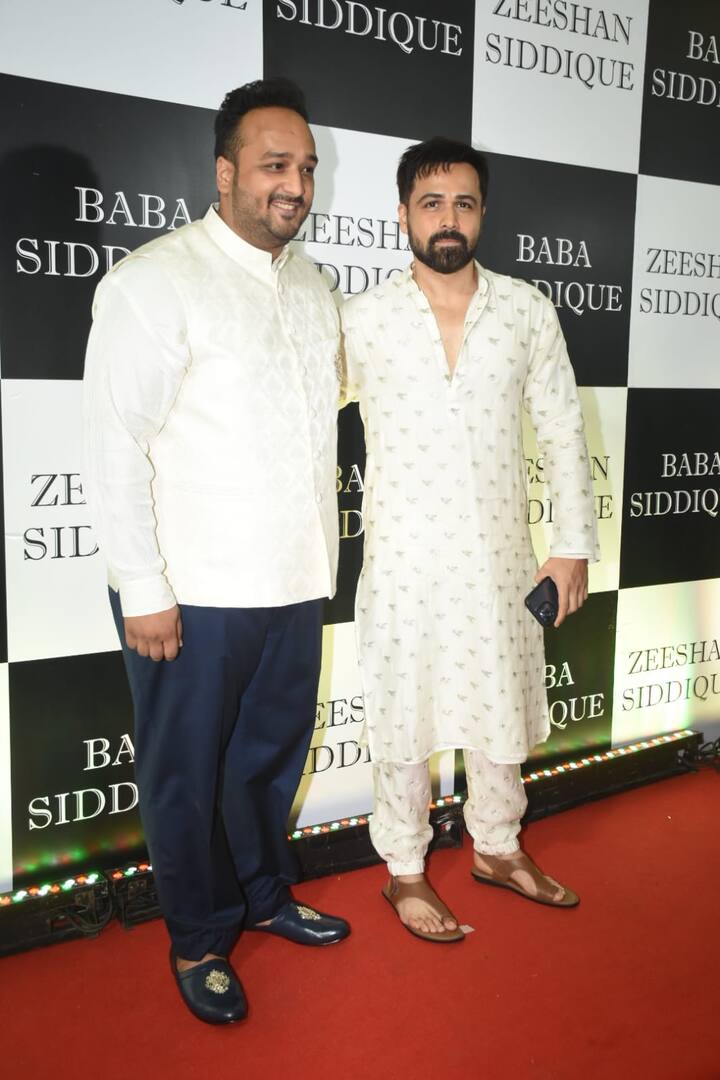 Emraan Hashmi kept it sober in a white kurta pajama with golden embroidery and struck a pose with host Zeeshan Siddique.