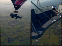 हवा में सैकड़ों फीट की ऊंचाई पर लटक रहे प्लेटफॉर्म पर शख्स ने किया स्टंट, वीडियो देख लगने लगेगा डर