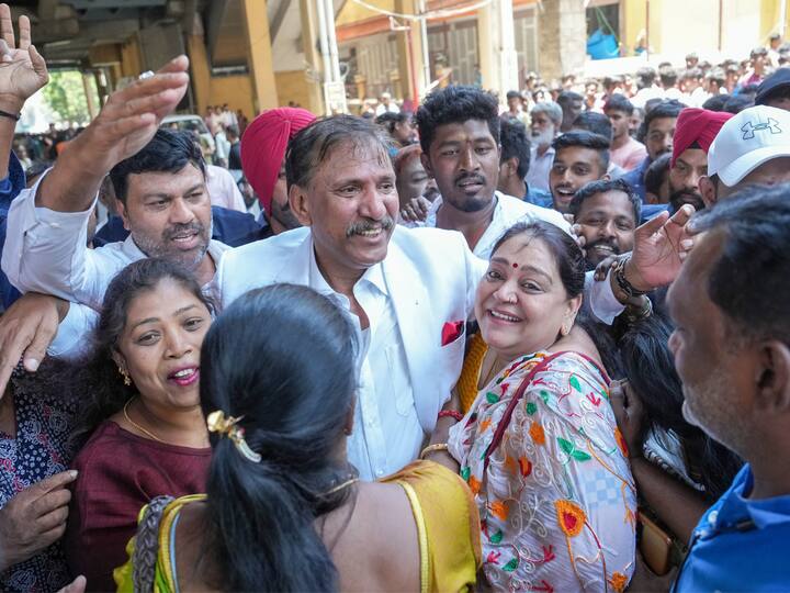 Congress leader Yousuf Shariff alias KGF Babu with supporters after filing the nomination papers for upcoming Assembly elections from Chickpete constituency, in Bengaluru. Image Source: PTI