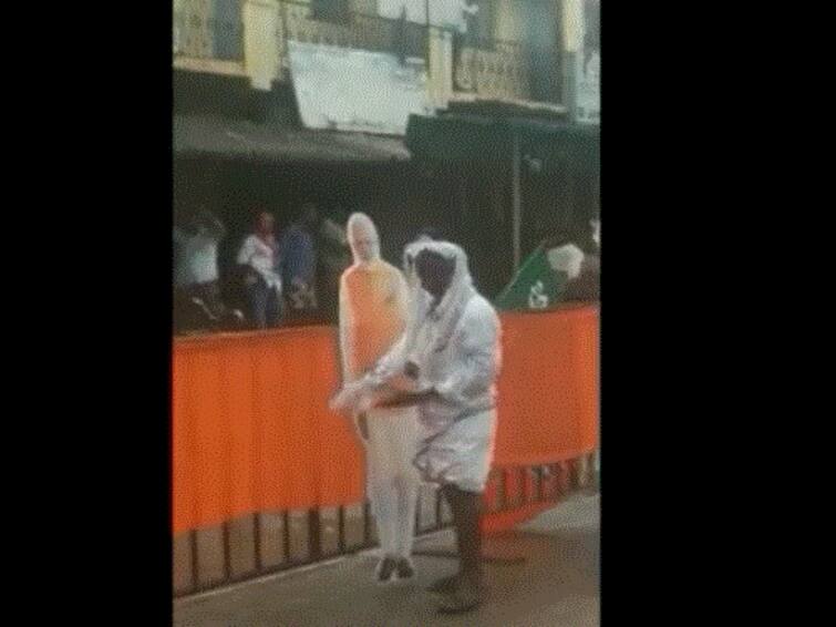 BJP Worker Wipes Off Rainwater From PM Modi's Cutout In Karnataka, Video Goes Viral BJP Worker Wipes Off Rainwater From PM Modi's Cutout In Karnataka, Video Goes Viral