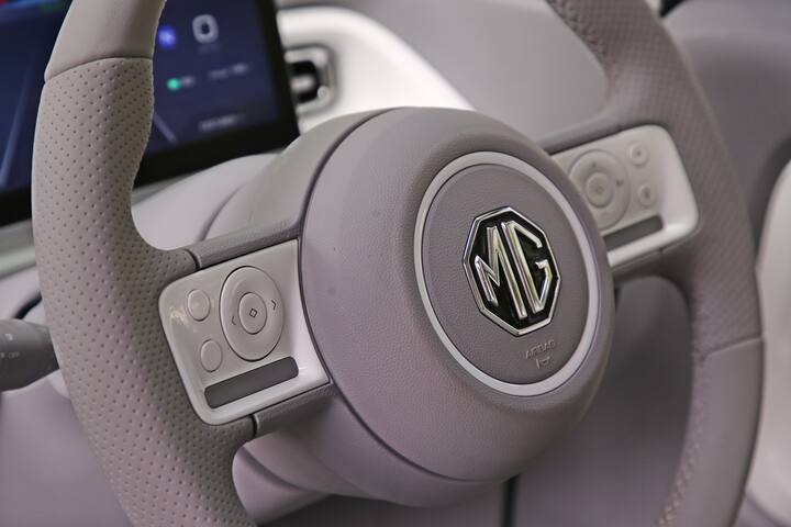 The car has a keyless entry and there is no start/stop button with a smart start system  Other features include tilt steering, front power windows, and manual AC.  In terms of technology, there is the i-SMART feature with 55 connected features.  The connected car features also include a digital key which is present on the more premium cars from MG Motor.  Wireless Android Auto and Apple CarPlay, 2 speaker audio system, 12V power socket, and 3 USB ports with fast charging are offered.