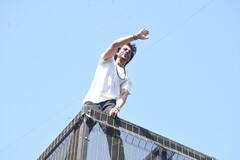 Shah Rukh Khan Greets Fans On Eid; Son AbRam Also Waves At Them. See Pics