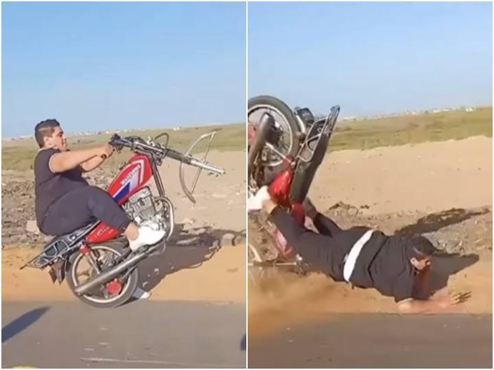Boy met with accident while doing stunt on bike पिछले पहिए पर बाइक को चला स्टंट कर रहा था युवक, अगले ही पल हुआ हादसे का शिकार