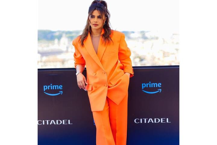 Priyanka Chopra attended the premiere in Rome in two stunning outfits- first, in a grass-green gown and then in an orange pant-suit. (Image Source: Instagram/Priyanka Chopra)