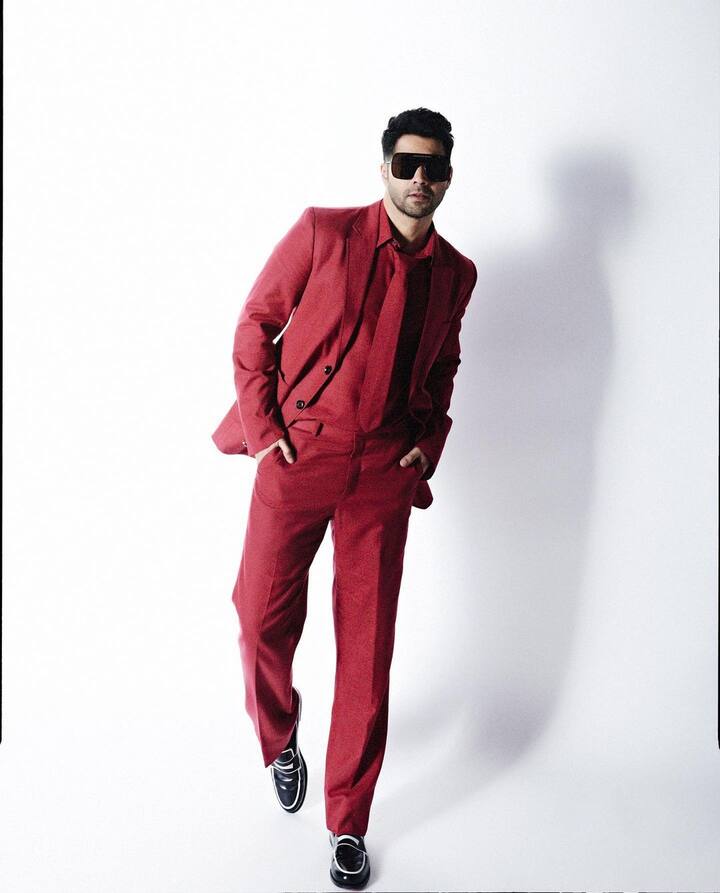 The actor in a red pantsuit from Sahil Aneja's line. To complete his formal look, the actor gave himself a patchy beard and a sleek, gelled-back haircut.