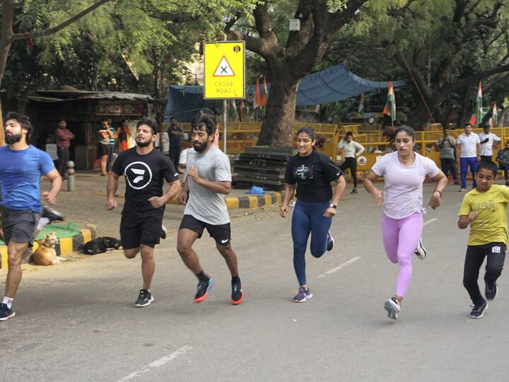 No FIR Filed Yet They Can't Stop Us Says Bajrang Punia While Holding Exercise Session At Jantar Mantar Wrestlers Protest WFI Chief Brij Bhushan Singh Vinesh Phogat Protesting Wrestlers Conduct Morning Exercise, Training Session At Jantar Mantar