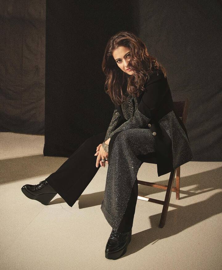 In a sleek black pantsuit, Kajol upped her red carpet look.