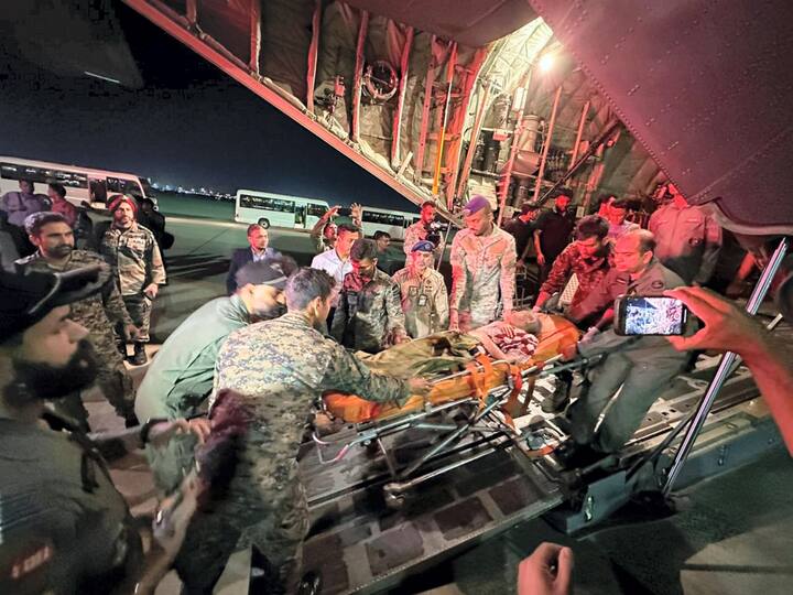 A woman was seen being carried on a stretcher by IAF officers as part of the rescue operations. (Image Source: PTI)