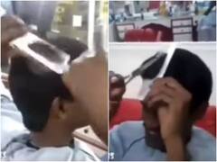 हाथों में कैंची लिए खुद के बाल काटते नजर आया नाई, वीडियो देख नहीं होगा आंखों पर यकीन