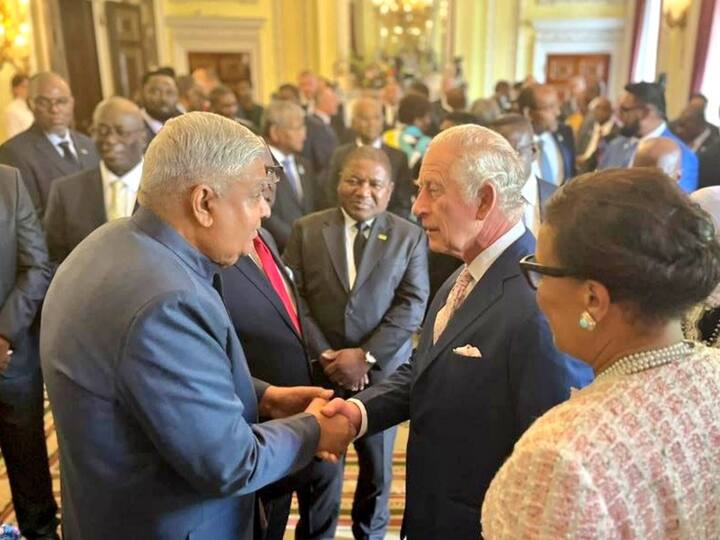 Vice President Jagdeep Dhankhar interacts with UK's King Charles III during a reception ahead of the coronation in London.