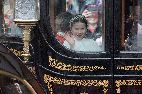 Princess Charlotte joined her parents in the first horse-drawn carriage behind the Gold State Coach. (Image Source: Getty)