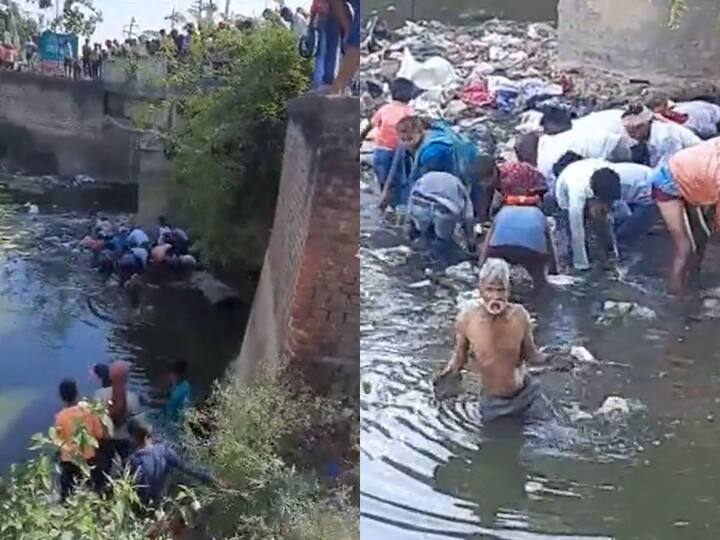 Watch Video People Jump Into Drain In Bihar To Collect Bundles of Currency Notes Viral Video: మురికి కాలువలో కరెన్సీ నోట్లు,ఒక్కసారిగా ఎగబడ్డ గ్రామస్థులు - వైరల్ వీడియో