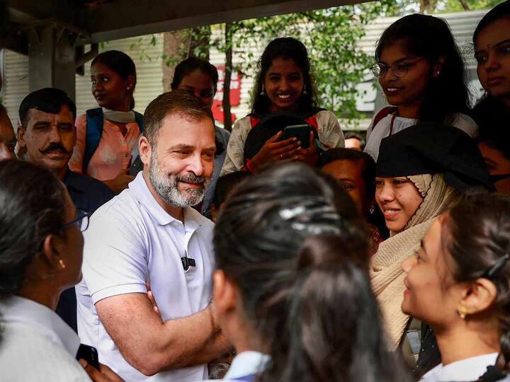 The Congress leader was first seen interacting with a bunch of college students and working women at a bus stop. He then hopped onto a BMTC bus. (Source: PTI)