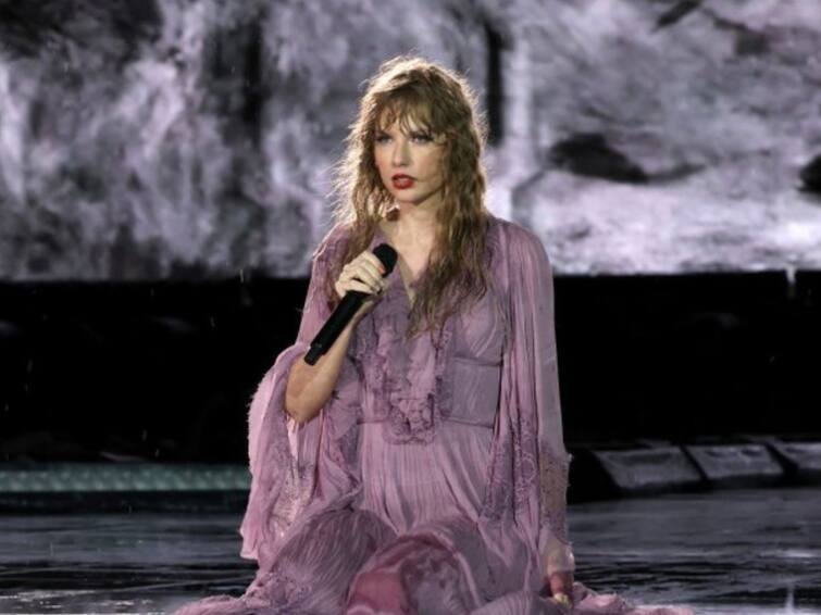 taylor swift;s concert gets delayed because of rain and she knew how to deal it Taylor Swift: கொட்டும் மழை: இசையில் நனைந்த கூட்டம்: டெய்லர் ஸ்விஃப்ட் கான்சர்டில் நிகழ்ந்த அதிசயம்
